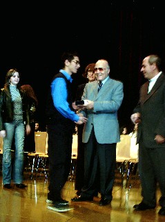 students receiving plaques